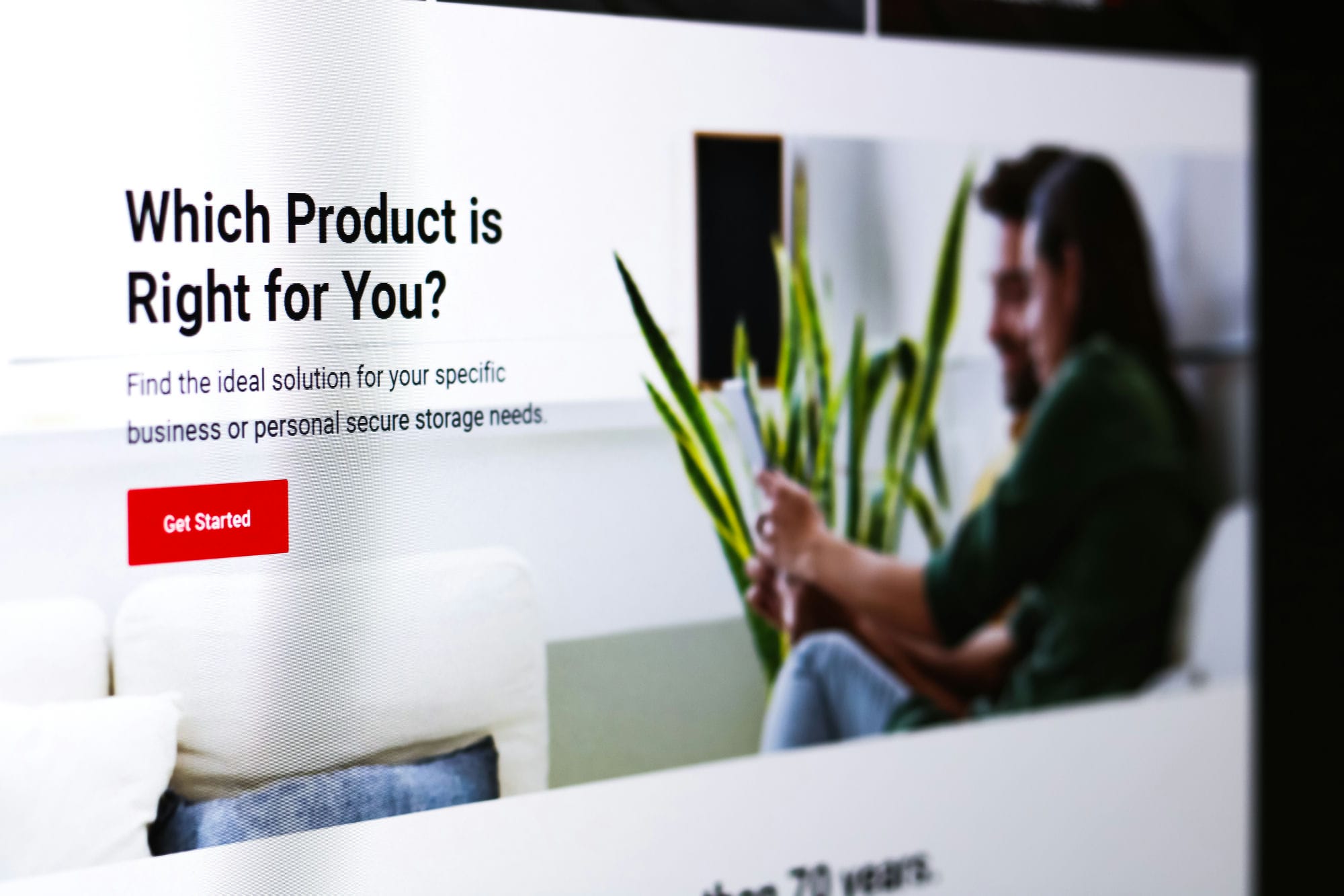 Web page header asking 'Which Product is Right for You?' with a 'Get Started' button, person with laptop in the background.