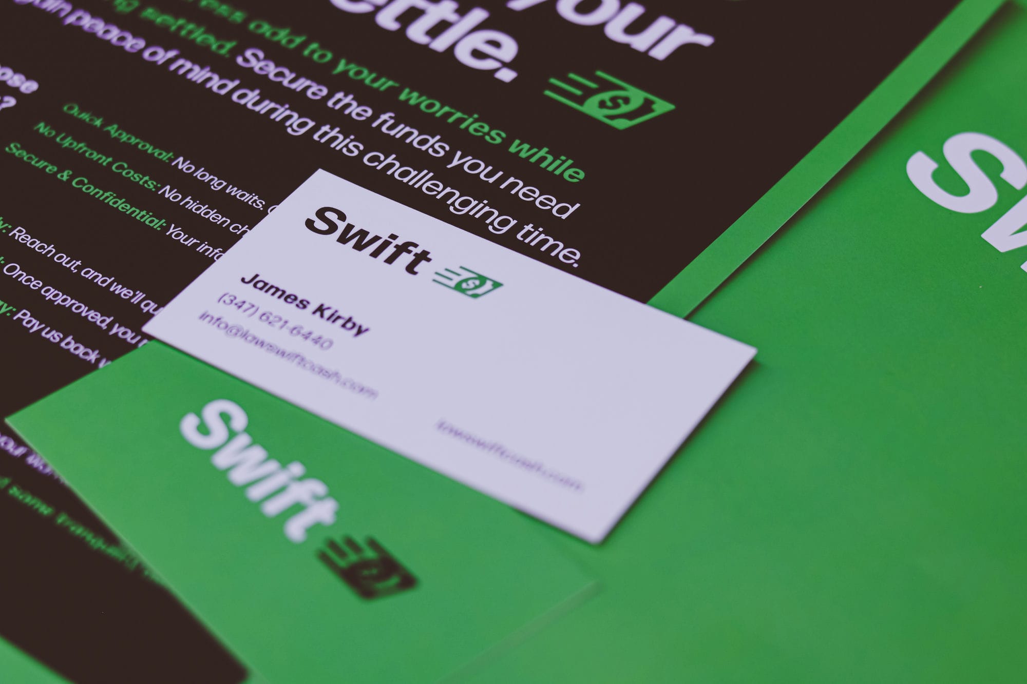 Close-up of a business card designed by Graticle for Swift Cash, featuring their bold green branding and contact information.
