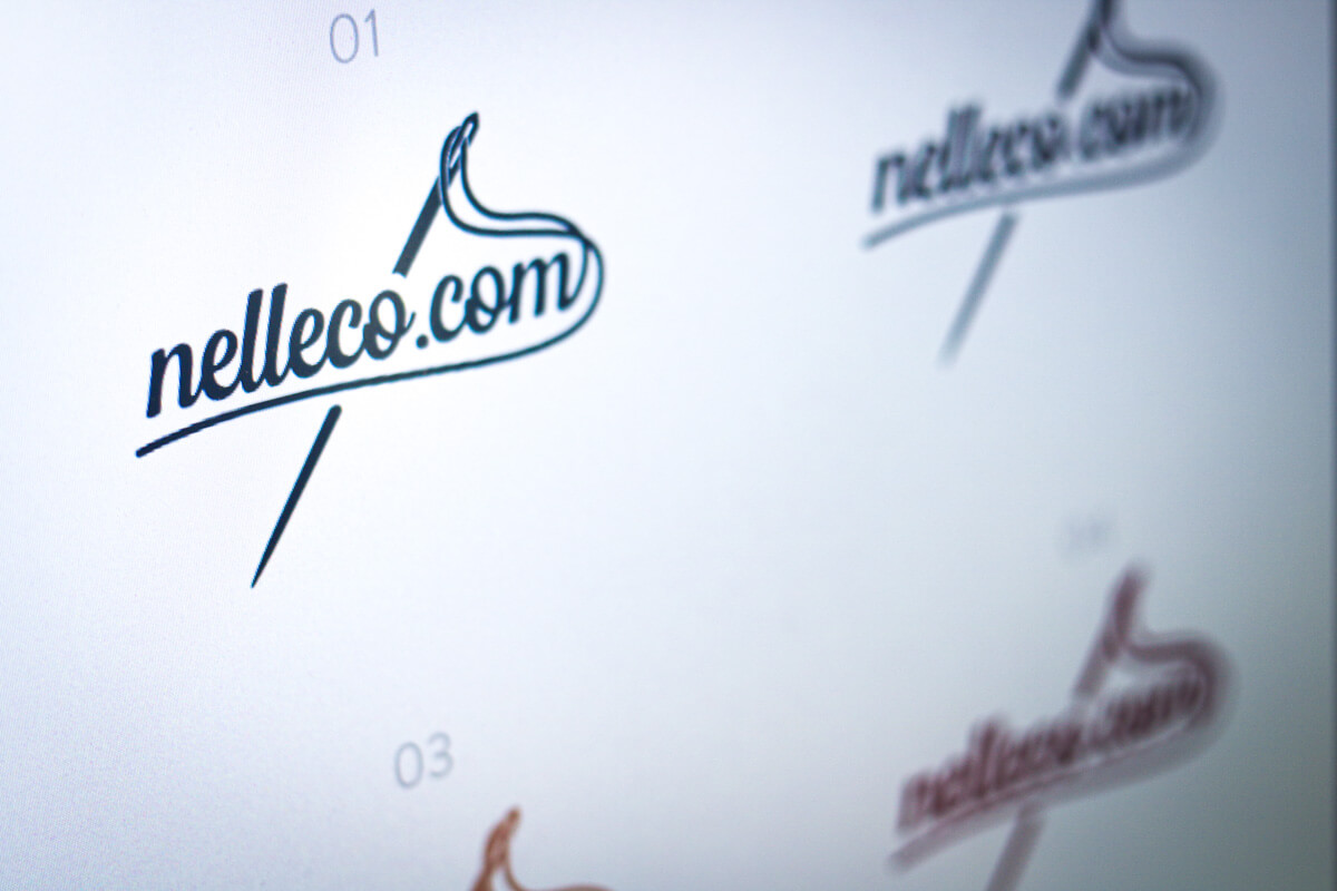 Photo of various logo concepts for a sewing company called nelleco.com