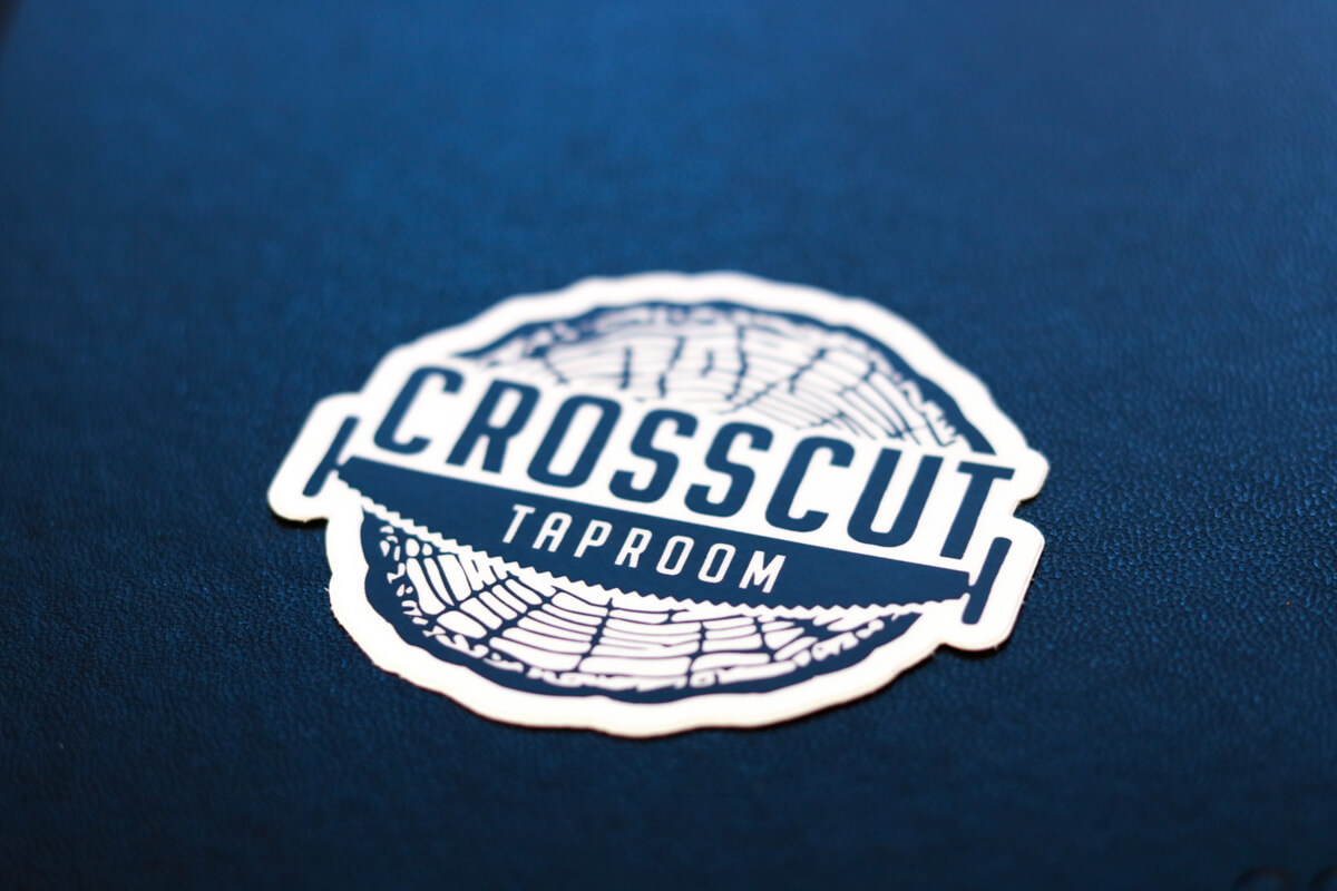 Photo of a sticker with the logo for Crosscut Taproom a taproom